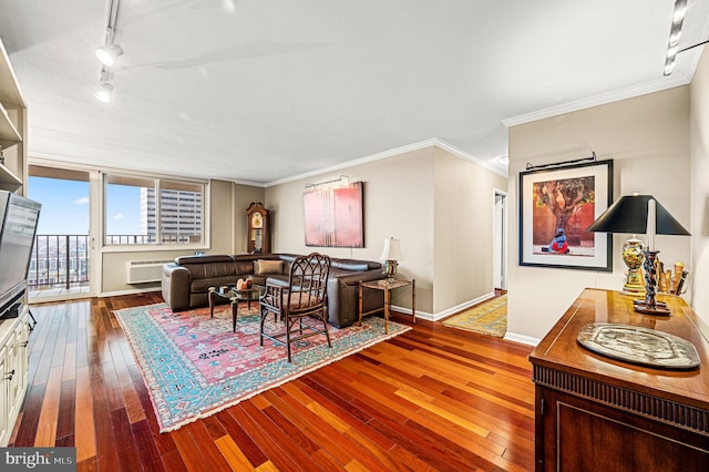 living room with hardwood / wood-style floors, crown molding, and track lighting