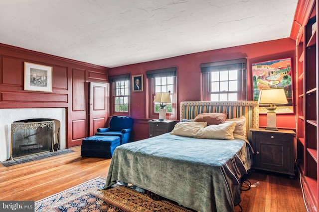 bedroom with dark hardwood / wood-style flooring