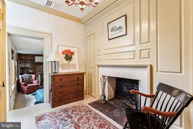 sitting room featuring an inviting chandelier and ornamental molding