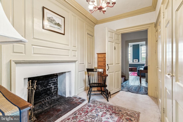 sitting room featuring light colored carpet, crown molding, and an inviting chandelier