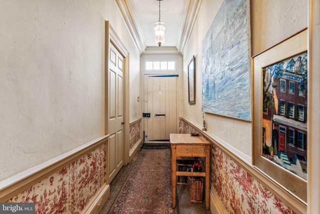 entryway with lofted ceiling and ornamental molding