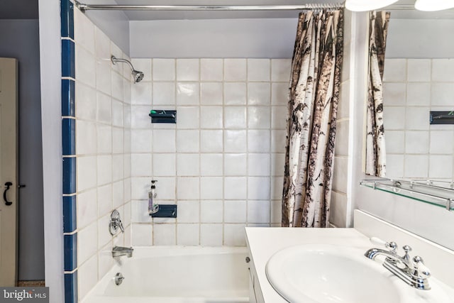 bathroom featuring vanity and shower / bathtub combination with curtain