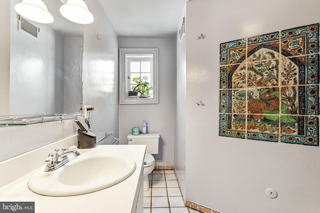 bathroom with tile patterned floors, vanity, and toilet