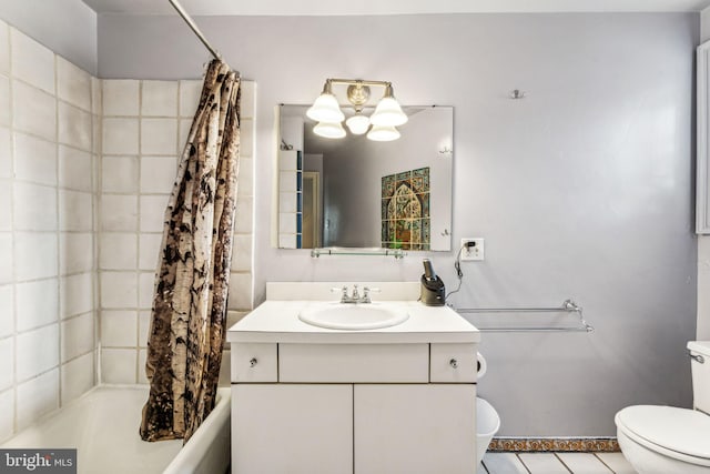 full bathroom featuring tile patterned floors, vanity, toilet, and shower / bath combo with shower curtain