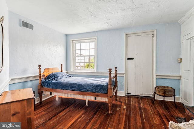 bedroom featuring dark hardwood / wood-style floors