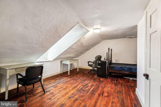 office with a textured ceiling, dark hardwood / wood-style floors, and lofted ceiling