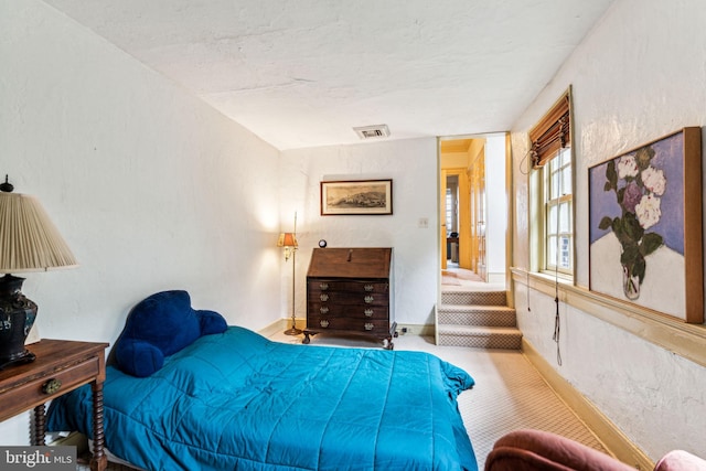 bedroom featuring carpet