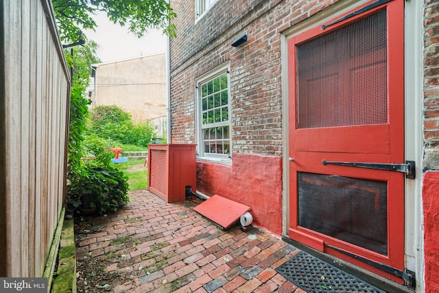 property entrance with a patio