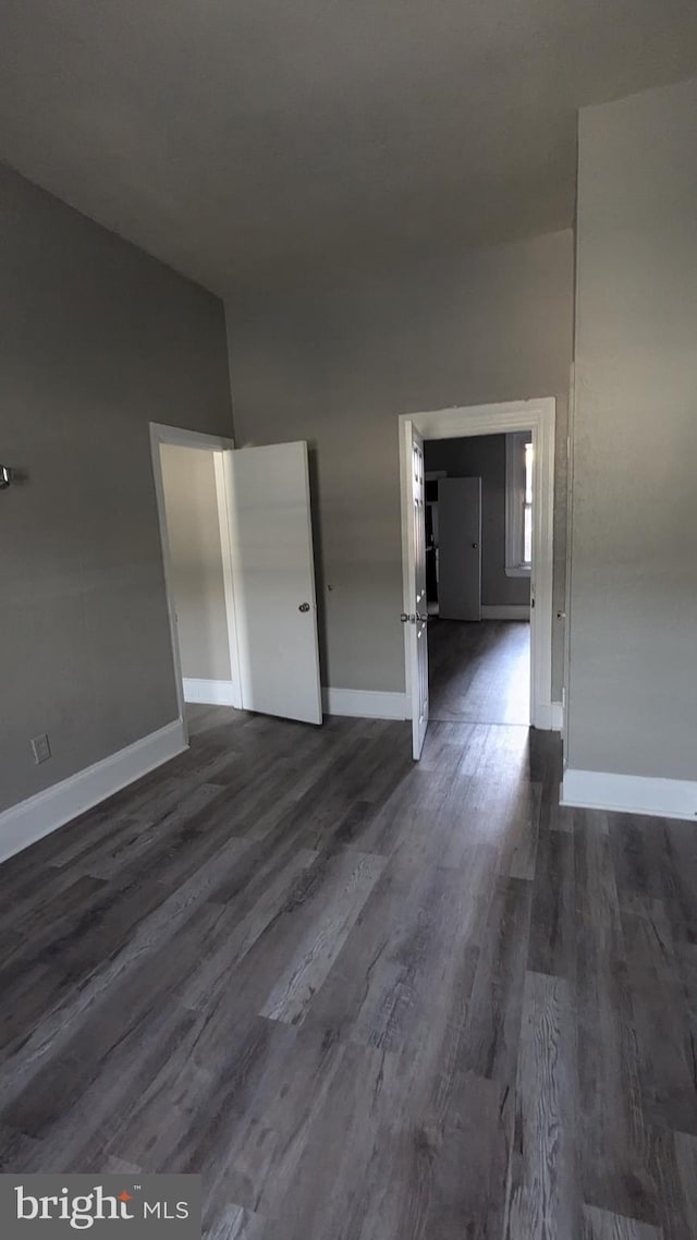 empty room featuring dark hardwood / wood-style floors