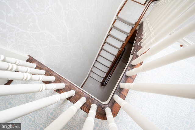 stairs featuring hardwood / wood-style flooring