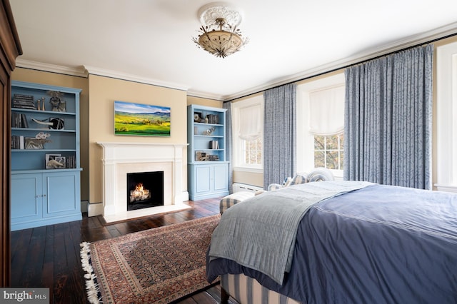 bedroom featuring dark hardwood / wood-style floors, a baseboard radiator, and ornamental molding