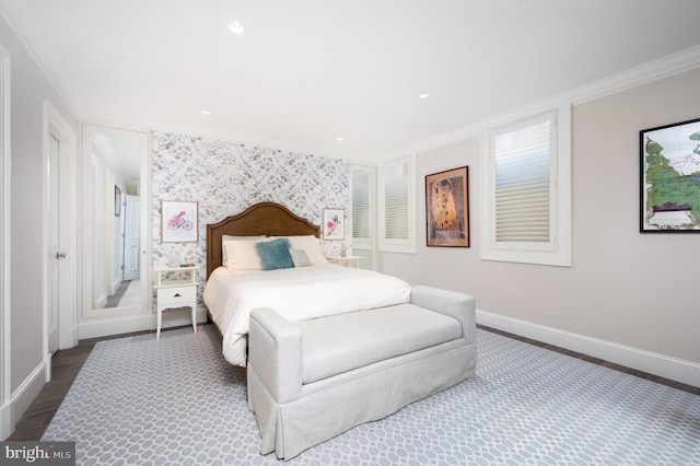 bedroom with crown molding and dark wood-type flooring