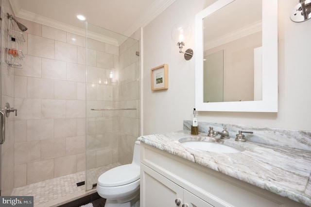 bathroom featuring vanity, toilet, and crown molding