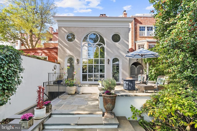 rear view of property with a patio area