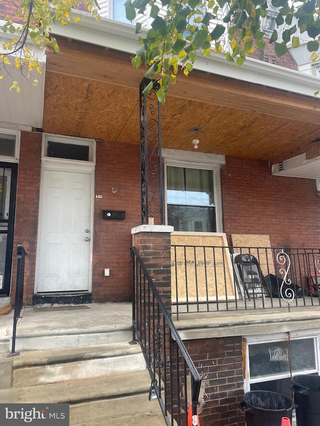 doorway to property with a porch