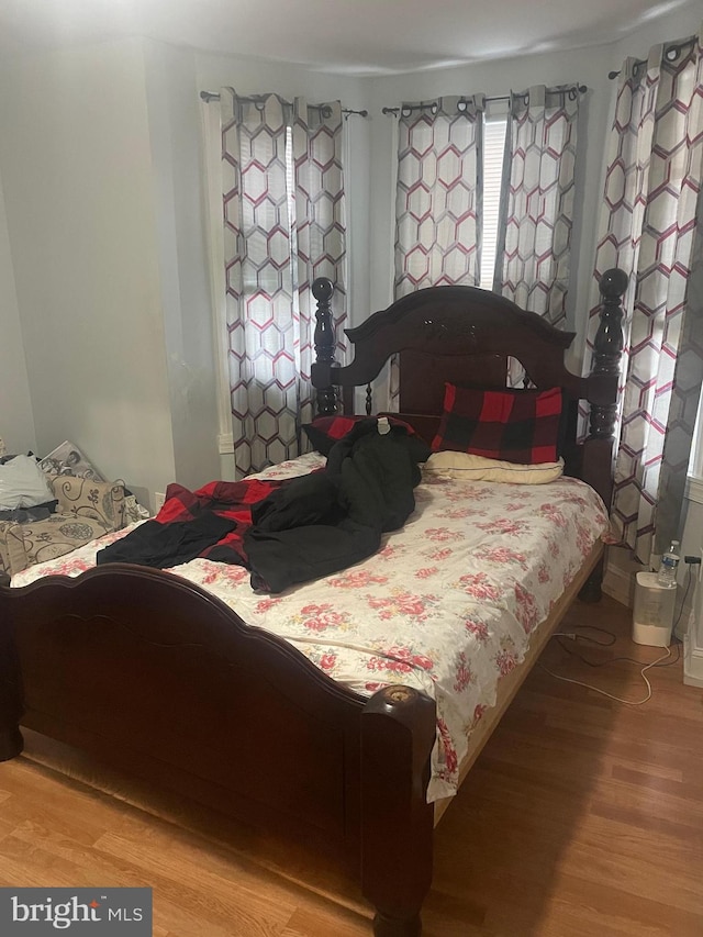 bedroom with light hardwood / wood-style flooring