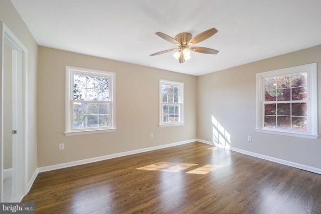 unfurnished room featuring ceiling fan and dark wood-type flooring