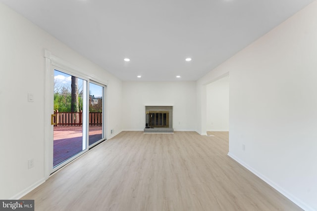 unfurnished living room featuring light hardwood / wood-style flooring