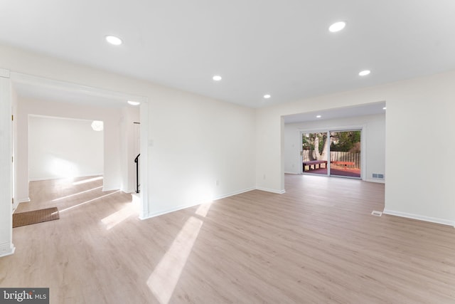 spare room featuring light hardwood / wood-style flooring