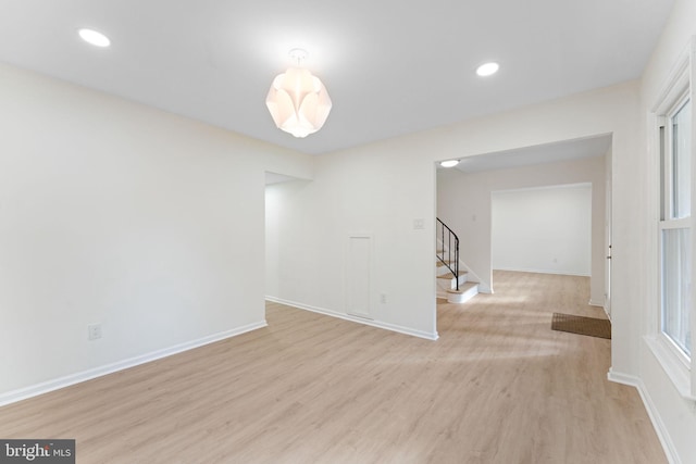 spare room featuring light wood-type flooring