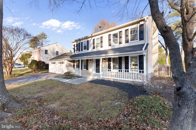 view of front of property with a front lawn and a porch