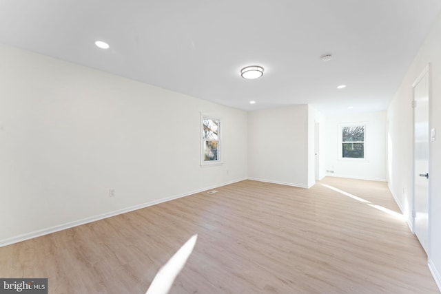 unfurnished room with plenty of natural light and light wood-type flooring