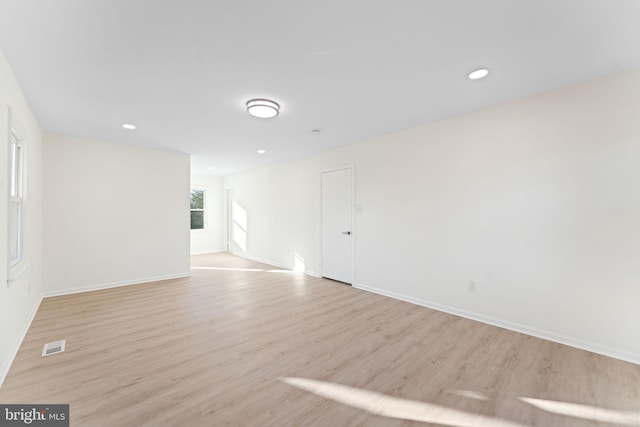 empty room with light hardwood / wood-style floors