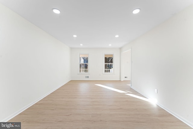 spare room with light hardwood / wood-style flooring