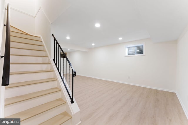 stairway with wood-type flooring