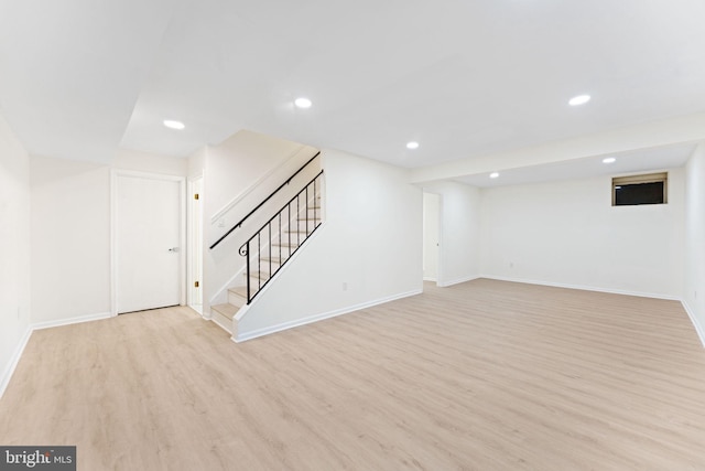 basement featuring light hardwood / wood-style flooring