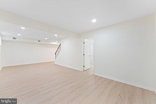 basement featuring light hardwood / wood-style floors