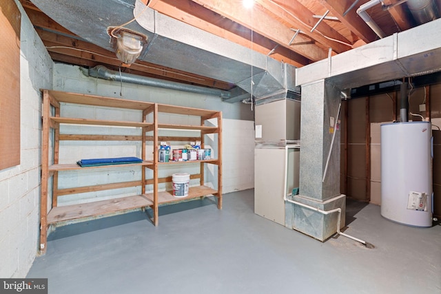 basement featuring heating unit and water heater