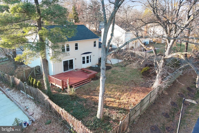 back of house with a wooden deck