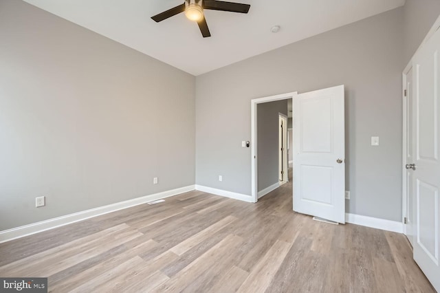 unfurnished bedroom featuring light hardwood / wood-style flooring and ceiling fan