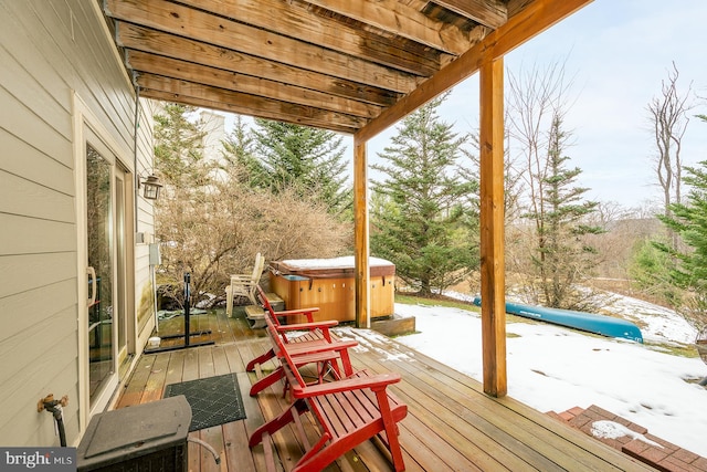 deck with a hot tub