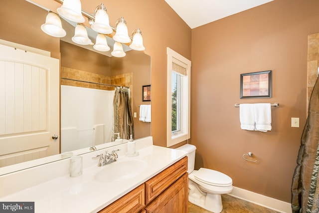 bathroom with tile patterned floors, vanity, a notable chandelier, toilet, and curtained shower