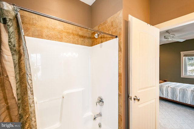 bathroom featuring ceiling fan and shower / bathtub combination with curtain