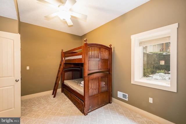 bedroom with ceiling fan and light colored carpet