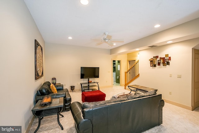 carpeted living room featuring ceiling fan