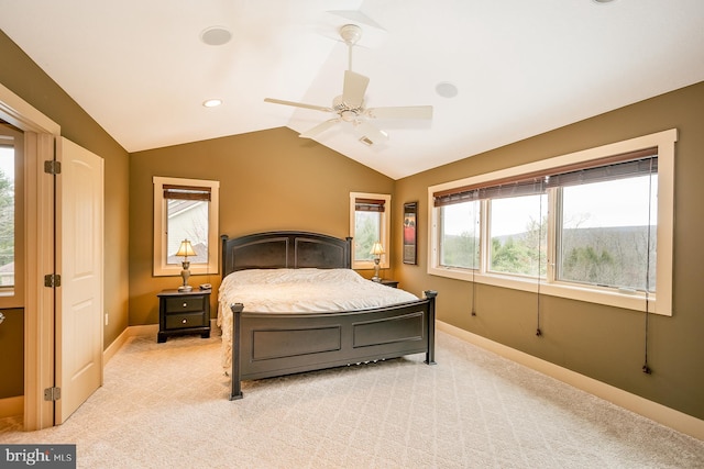 bedroom featuring ceiling fan, light carpet, and vaulted ceiling