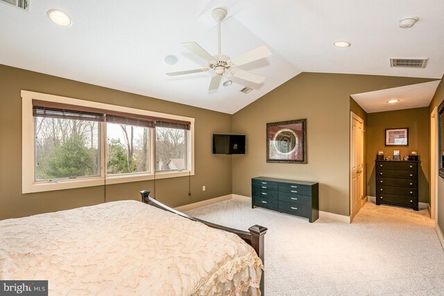 carpeted bedroom featuring ceiling fan and vaulted ceiling