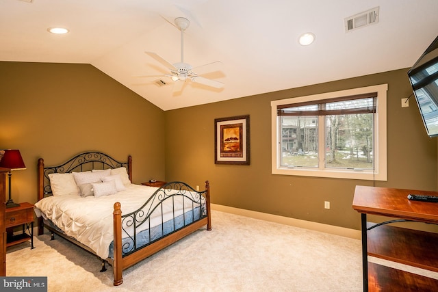 carpeted bedroom featuring ceiling fan and vaulted ceiling