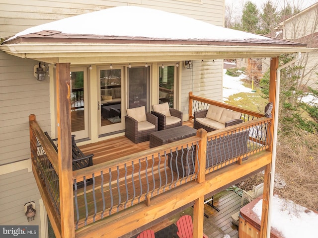 wooden terrace featuring an outdoor living space