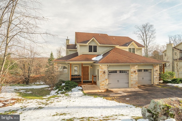 view of front of house with a porch and a garage