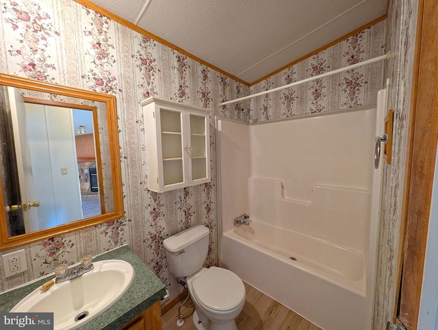 full bathroom with shower / bathtub combination, vanity, a textured ceiling, vaulted ceiling, and hardwood / wood-style floors