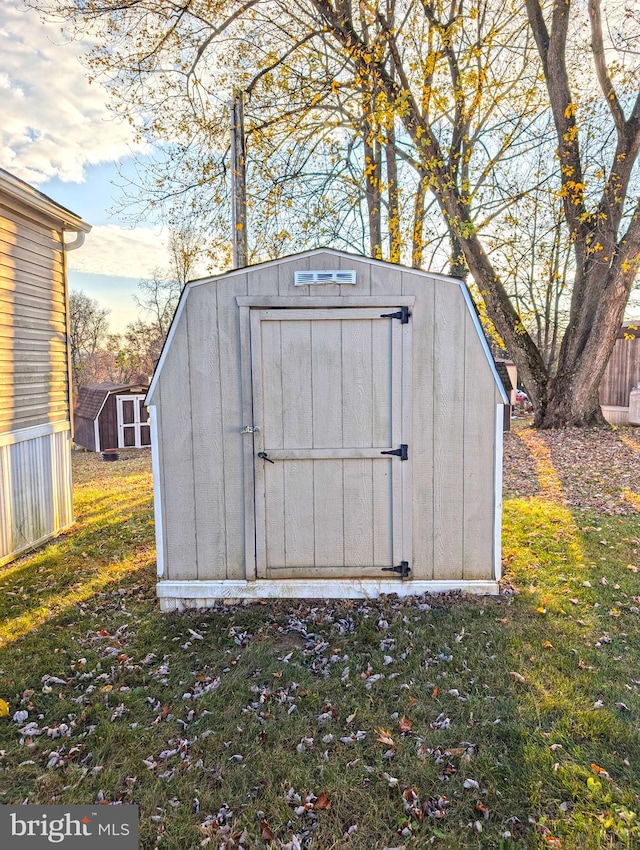 view of outdoor structure with a lawn