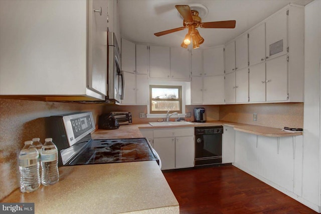 kitchen with dishwasher, sink, dark hardwood / wood-style flooring, stove, and white cabinets