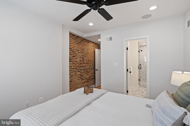 bedroom featuring ceiling fan, brick wall, and ensuite bath