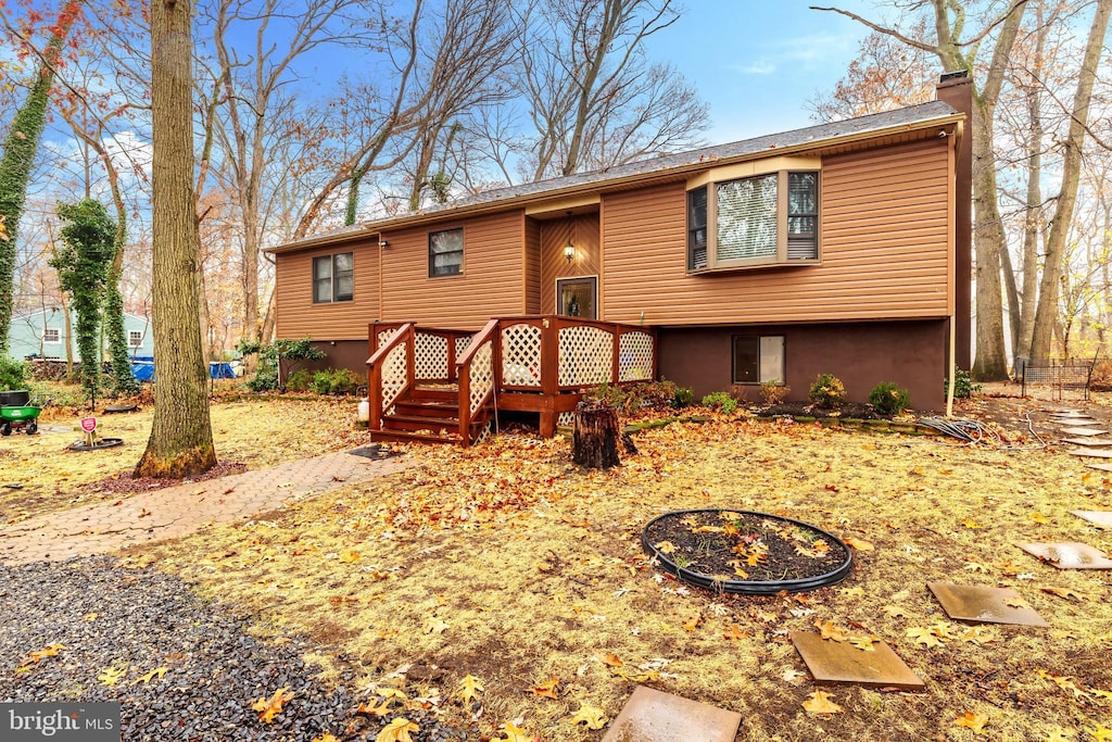 716 Marshall St, Edgewater Park, NJ 08010 - split foyer home featuring a chimney and a deck