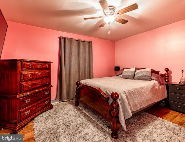 bedroom with ceiling fan and light hardwood / wood-style floors